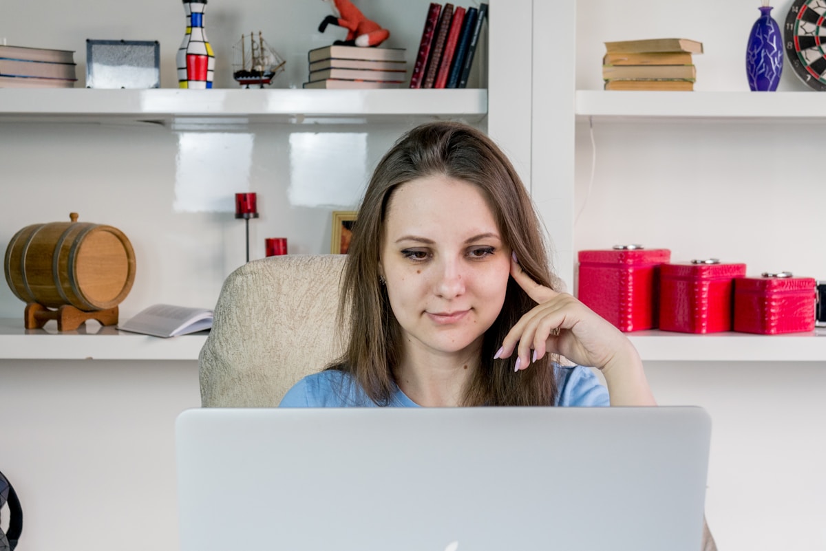 College student tracking budget on a laptop in a study space