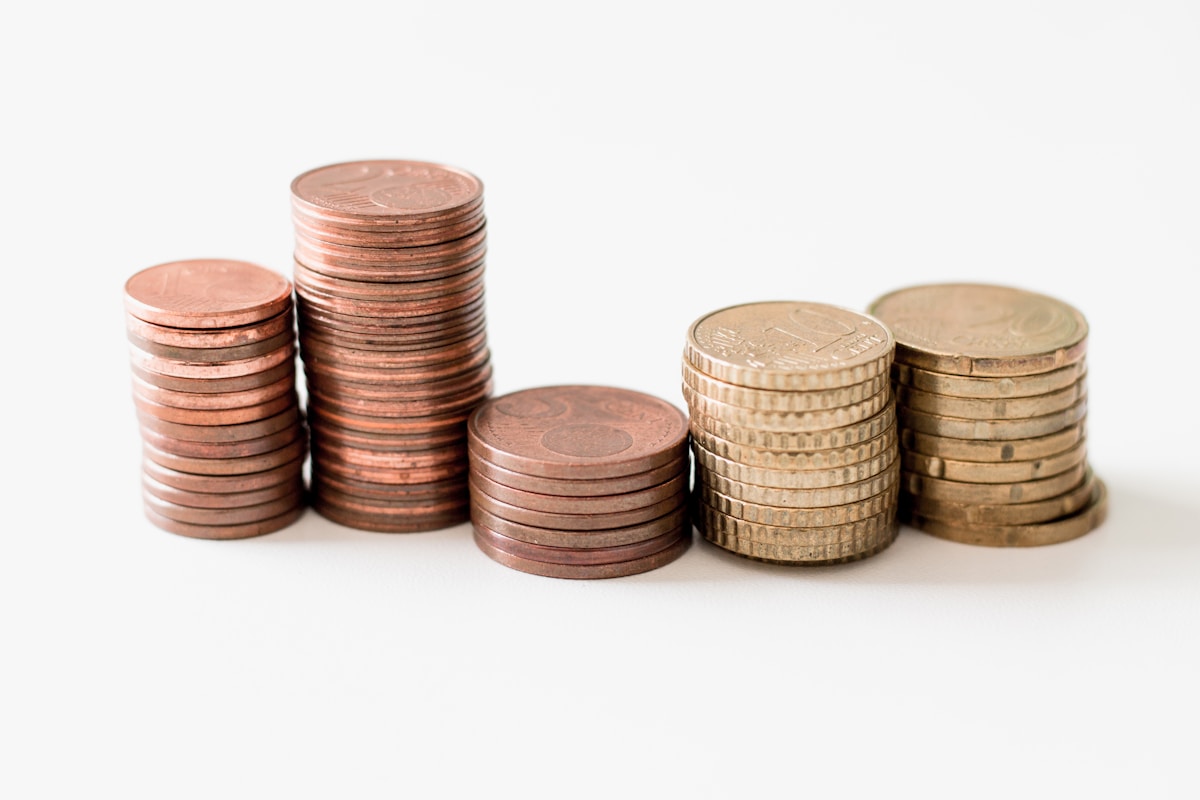 Stack of coins growing as savings build up over time