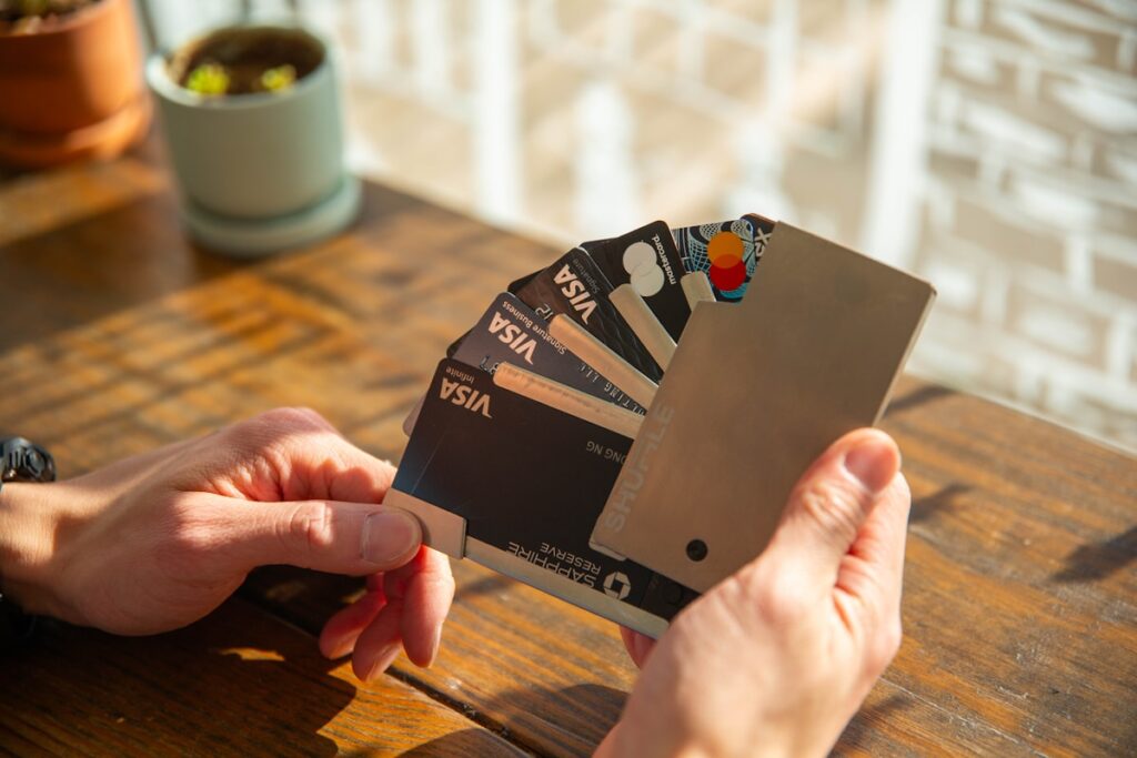 Person reviewing credit card statements to assess excessive debt