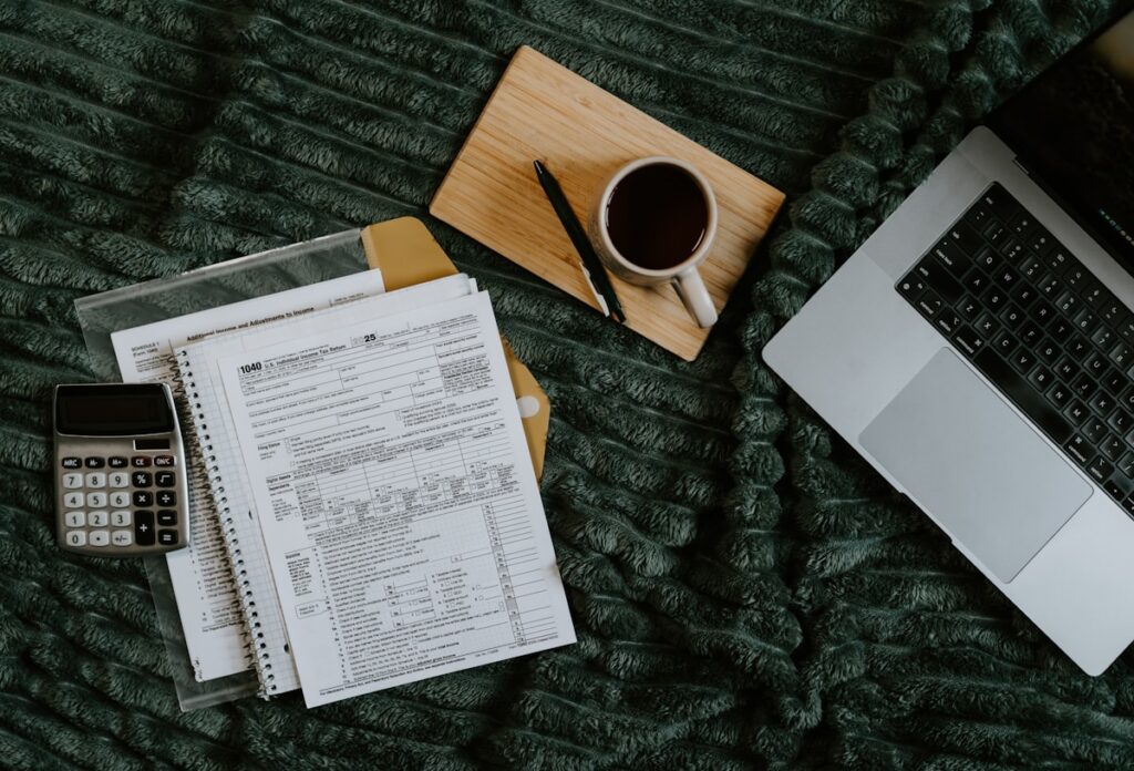 Planning SMART financial goals with laptop, calculator, and notes