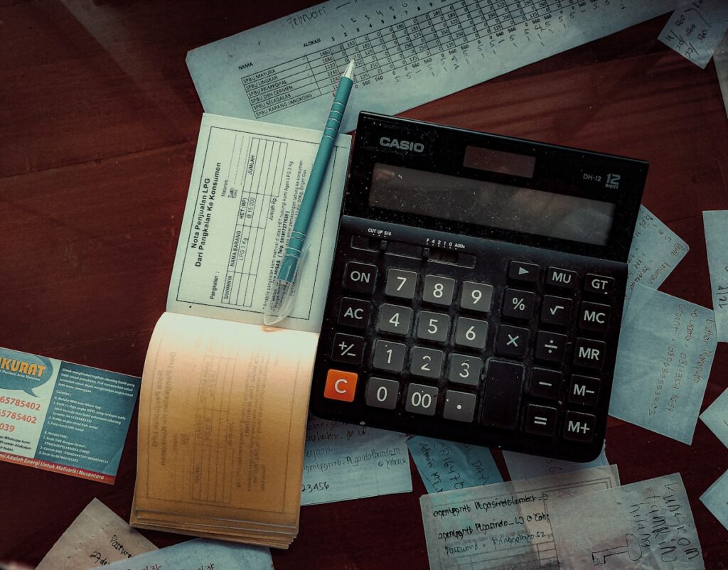 Calculator on table representing top budgeting tips