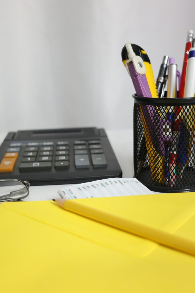 Calculator and envelope showing why traditional budgets fail